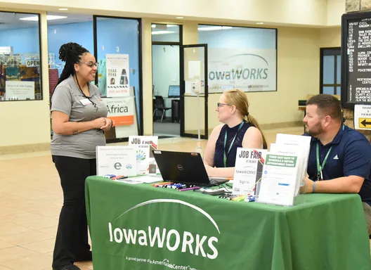 Person reviewing paperwork while applying for unemployment benefits online