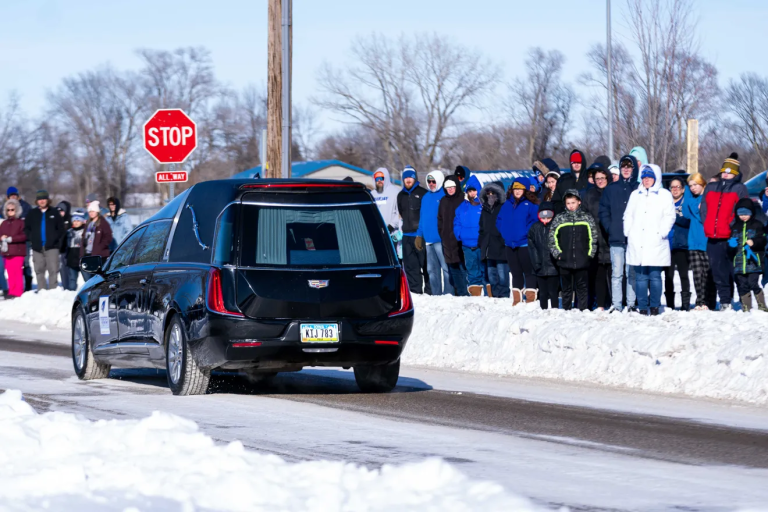 Perry residents line street as body of Dan Marburger, who died saving students, comes home
