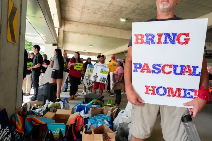 Protesters gathered to demand elected officials return Pascual Pedro and release Noel Lopez through a march, rally and canned food drive July 29, 2025 near the U.S. Courthouse in Cedar Rapids, Iowa.