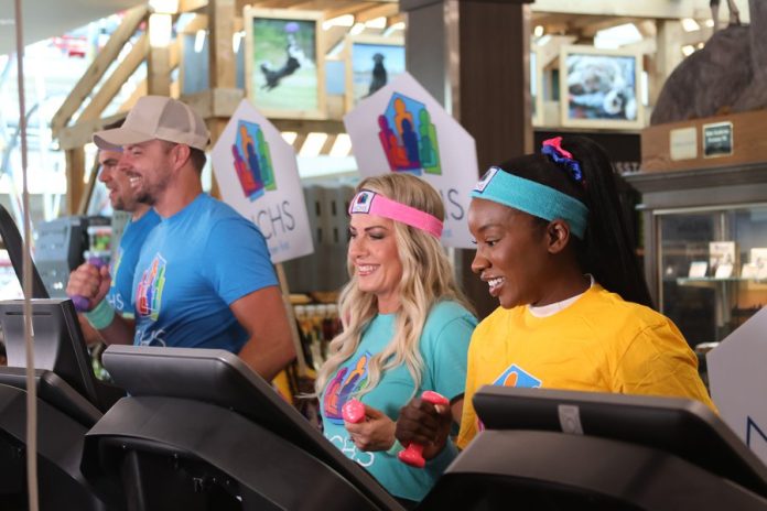 Nebraska Children's Home Society participants show off their exercise skills at an event in the Omaha Scheels location. (Photo by Theodore Ball/Nebraska Public Media News)