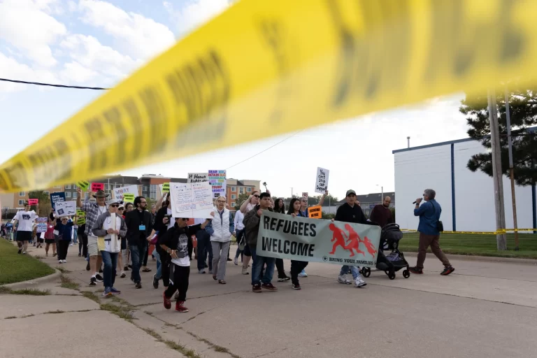 Iowans rally to support immigrants at ICE check-ins, despite federal perimeter