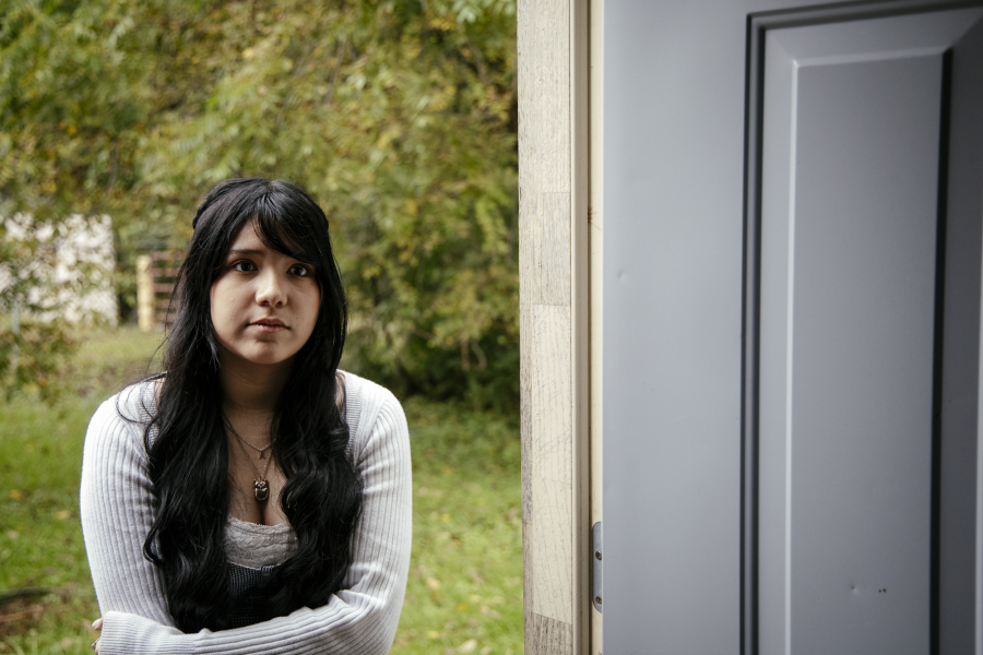 Abigail Lopez looks toward the garage at her family’s Des Moines home.
