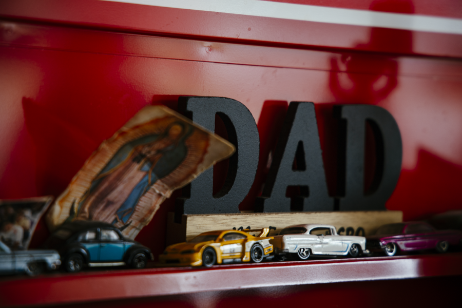 Juan Lopez's red toolbox contains family photos and a Guadalupe image.